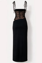 A black midi dress with a sheer black lace corset-style bodice and thin shoulder ties, shown against a plain off-white background.