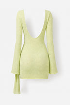 A light lime green knit long-sleeve top with a very deep V-neckline and a draped tie detail on one sleeve, shown against a plain white background.