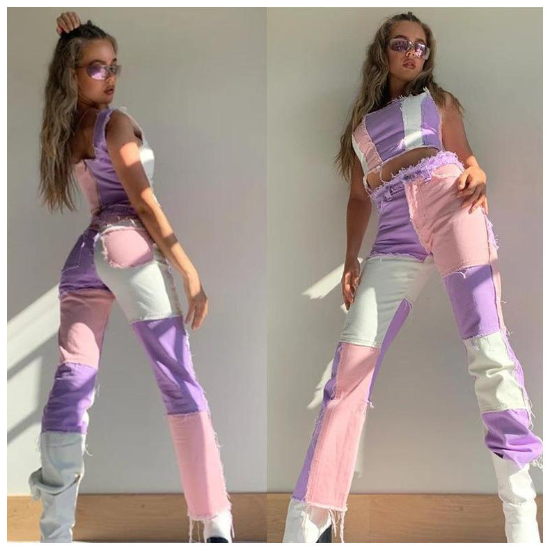 Woman wearing a pastel-colored outfit with a top and pants in shades of purple, pink, and white.