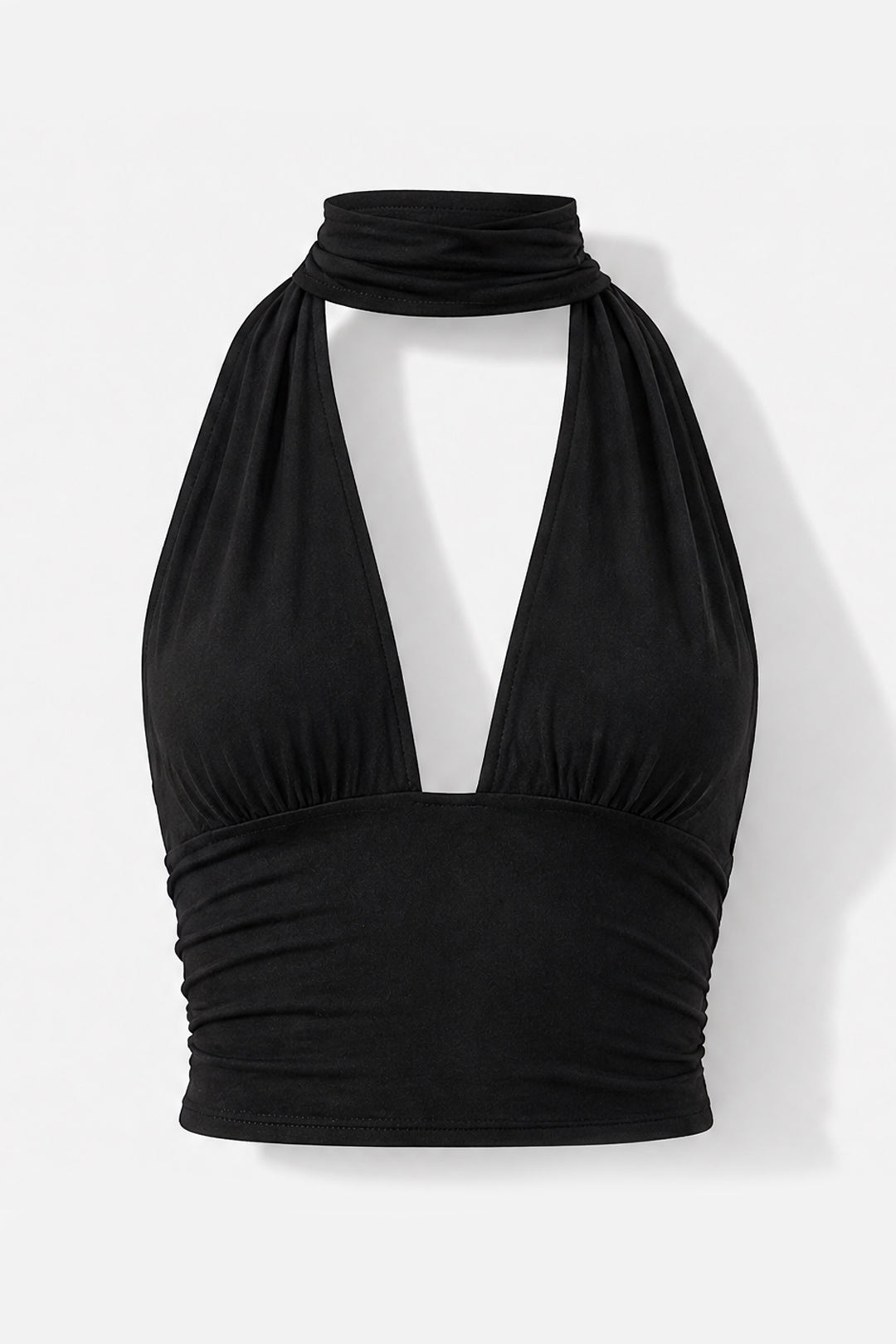 A black halter-style crop top with a deep V-neckline and gathered ruching at the bust and waist, shown on a plain light background.