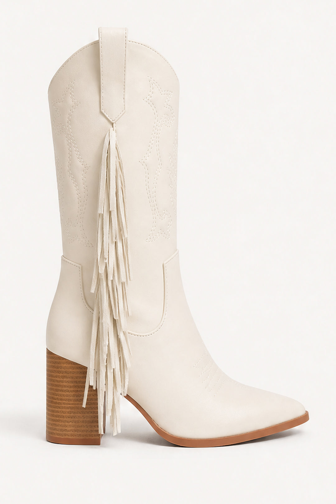 An off-white leather cowboy boot with a pointed toe, a stacked brown block heel, and a long fringe detail on the side, shown against a plain white background.