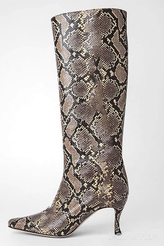 A single knee-high pointed-toe boot with a metallic snakeskin pattern in shades of bronze, brown, and gold, set against a plain light gray background.