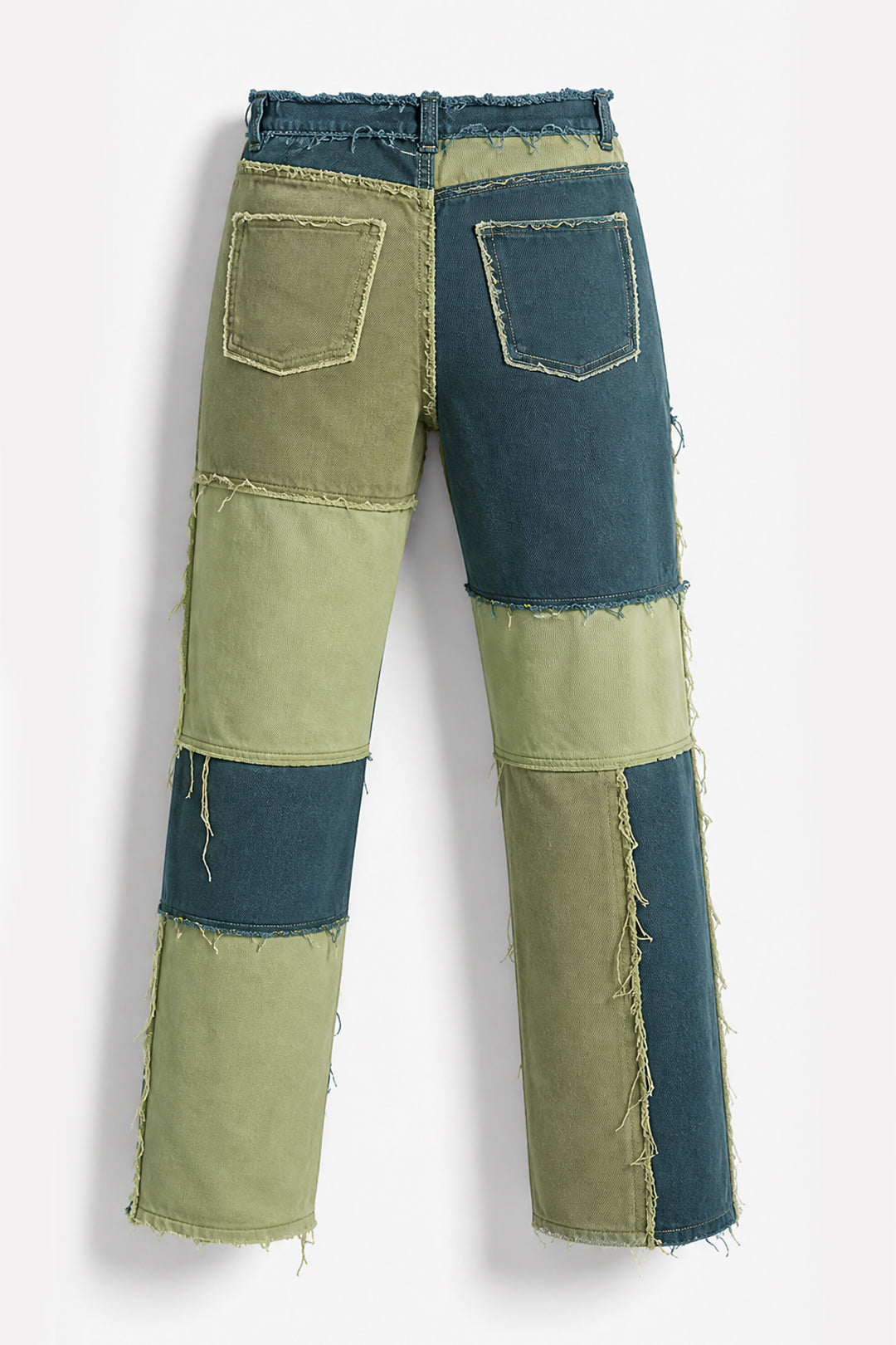 Patchwork denim jeans with a mix of blue and olive green denim panels, frayed edges, and two back patch pockets, shown against a light gray background.
