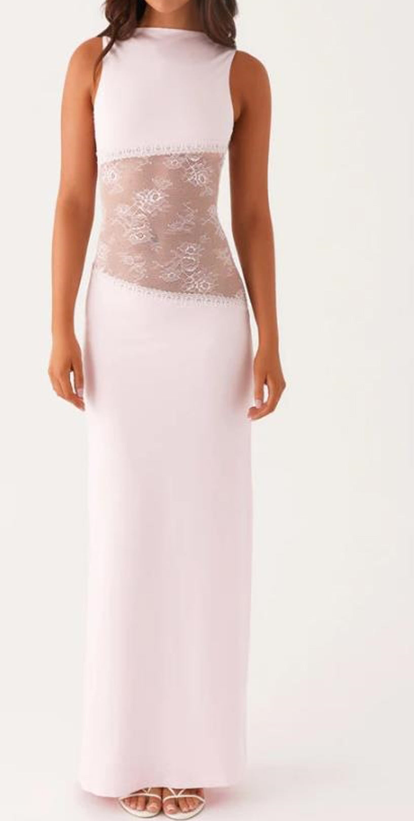 A sleeveless light pink maxi dress with a sheer floral lace panel at the waist, shown on a model against a plain white background.