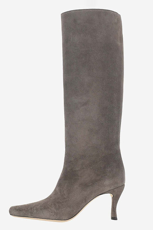 A single knee-high boot in dark gray suede with a pointed toe and a slim kitten heel, shown against a plain white background.