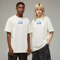 Two people wearing white t-shirts with 'studio K01' logo on a gray background